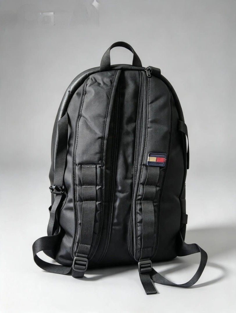 Tommy Hilfiger Black Leather Backpack (Category: Backpacks) located in Quezon City. Submitted by amber___18 (Listing ID 1470353717, Image 3). Description: - Brand: Tommy Hilfiger - Color: Classic Black - Material: Premium faux leather with padded mesh back panel - Storage: Roomy main compartment with dual zippers and front zippered pocket - Comfort: Adjustable shoulder straps and top grab handle - Extra: Side compression straps with release buckl