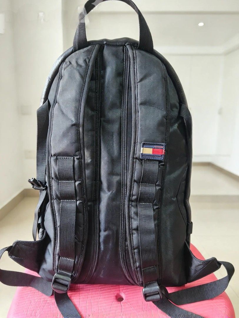 Tommy Hilfiger Black Leather Backpack (Category: Backpacks) located in Quezon City. Submitted by amber___18 (Listing ID 1470353717, Image 2). Description: - Brand: Tommy Hilfiger - Color: Classic Black - Material: Premium faux leather with padded mesh back panel - Storage: Roomy main compartment with dual zippers and front zippered pocket - Comfort: Adjustable shoulder straps and top grab handle - Extra: Side compression straps with release buckl
