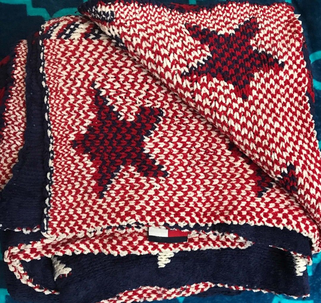 Tommy Hilfiger Knit Star Blanket Single size (Category: Bedding & Towels) located in Imus. Submitted by stop_shop7 (Listing ID 1470359689, Image 1). Description: - Authentic Tommy Hilfiger knit throw blanket - Classic navy blue, red, and white colorway with star patterns - Features red striped borders and iconic flag logo patch - Soft and cozy knit texture, ideal for living room or bedroom - Perfect home decor accessory or gift.