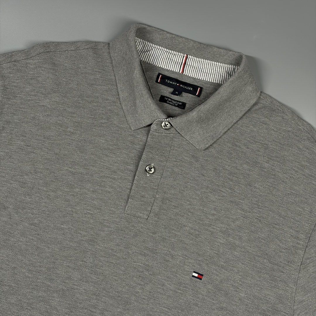 Tommy Hilfiger the 1985 Poloshirt (Category: Activewear) located in Cavite. Submitted by onebeancent (Listing ID 1470458744, Image 3). Description: Size: XL Dimension: 23" Width | 28" Length Color: Grey Color Rate: 10/10 Issue: None Condition: Like new‼️ Price: 880php Additional Shipping Fee (J&T Small Pouch) 75php Luzon 100php visayas 120php mindanao.