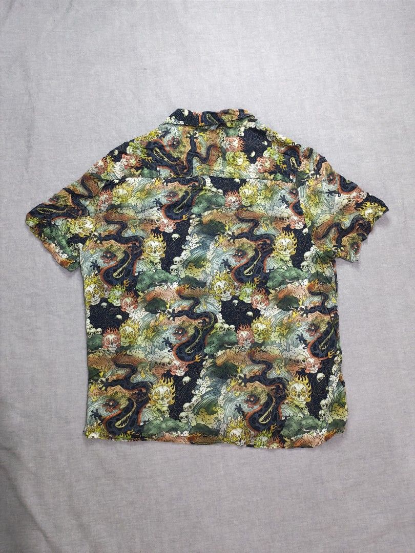 Topman skull dragon loop collar shirt (Category: Tshirts & Polo Shirts ) located in Baguio. Submitted by used_clothing2600 (Listing ID 1470507834, Image 2). Description: Topman skull dragon loop collar shirt size medium verygood condition pit to pit 22 length 27 shoulders 17 sleeve length 9.5 P 980.