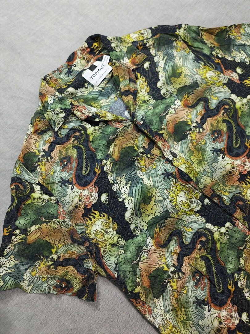 Topman skull dragon loop collar shirt (Category: Tshirts & Polo Shirts ) located in Baguio. Submitted by used_clothing2600 (Listing ID 1470507834, Image 3). Description: Topman skull dragon loop collar shirt size medium verygood condition pit to pit 22 length 27 shoulders 17 sleeve length 9.5 P 980.