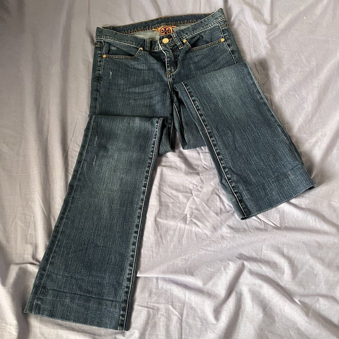 Tory Burch Blue Denim Jeans (Category: Jeans) located in Manila. Submitted by prelovedpick.com (Listing ID 1470404228, Image 2). Description: - Brand: Tory Burch - Size: 25 - Wash: Medium blue with orange contrast stitching - Fit: Bootcut / flare leg silhouette - Details: Branded gold-tone hardware on button and rivets, classic 5-pocket styling - Condition: Great addition to any casual wardrobe.