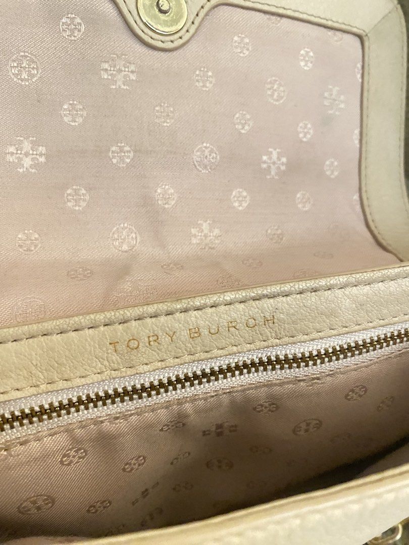 Tory Burch Bombe Mini Flap Beige (Category: Luxury Bags & Wallets) located in Pagadian. Submitted by everbeauxsacs (Listing ID 1470365418, Image 3). Description: - Brand: Tory Burch - Material: Premium beige pebble leather - Hardware: Elegant gold-tone mixed with leather chain strap - Closure: Secure magnetic snap under front flap - Exterior: Chic debossed logo circle on front, convenient back slip pocket - Interior: Monogram fabric lining with a