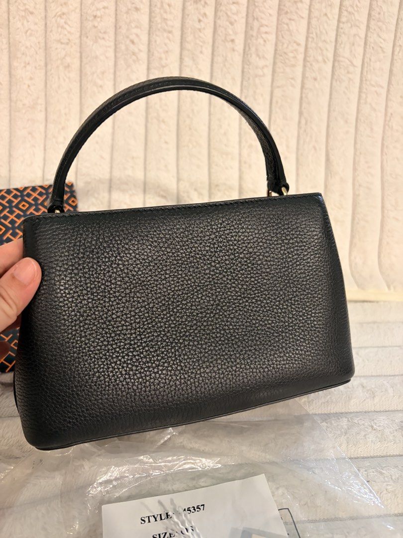 Tory Burch Britten Micro Satchel (Category: Luxury Bags & Wallets) located in Valenzuela. Submitted by sulishop (Listing ID 1470375225, Image 2). Description: Lightly used, no flaws, fresh, cute. Original from US Tory Burch Store. Bought for 12k php. Selling low. Decluttering. Micro size. Long wallet wont fit. Can fit phone, and small wallet. Top handle handbag. Leather, black, paper bag, and tag. .
