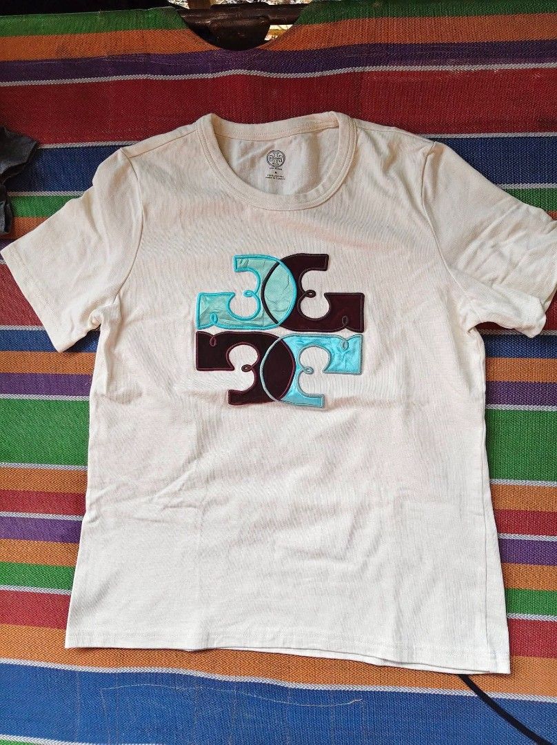 Tory Burch Crew neck Tshirt (Category: Tshirts & Polo Shirts ) located in Mabalacat. Submitted by zero2mthrift (Listing ID 1470422812, Image 1). Description: Excellent condition to As new No flaws Size Meduim on Tag 19.5 x 27 Complete tags and details Location: Pampanga.