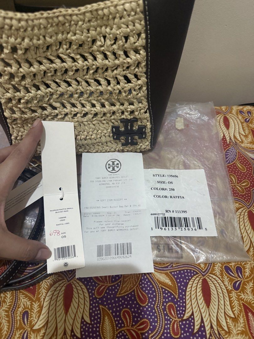 Tory Burch McGraw Raffia Small Bucket Bag (Category: Luxury Bags & Wallets) located in Quezon City. Submitted by msaisa (Listing ID 1470385852, Image 2). Description: - Brand: Tory Burch - Style Number: 135656 (Color: 250 Raffia) - Size: OS - Condition: Brand new with original tags attached - Material: Textured raffia weave with dark leather trim - Includes: Detachable shoulder strap - Design: Structured shape with front Double T logo detail - Va