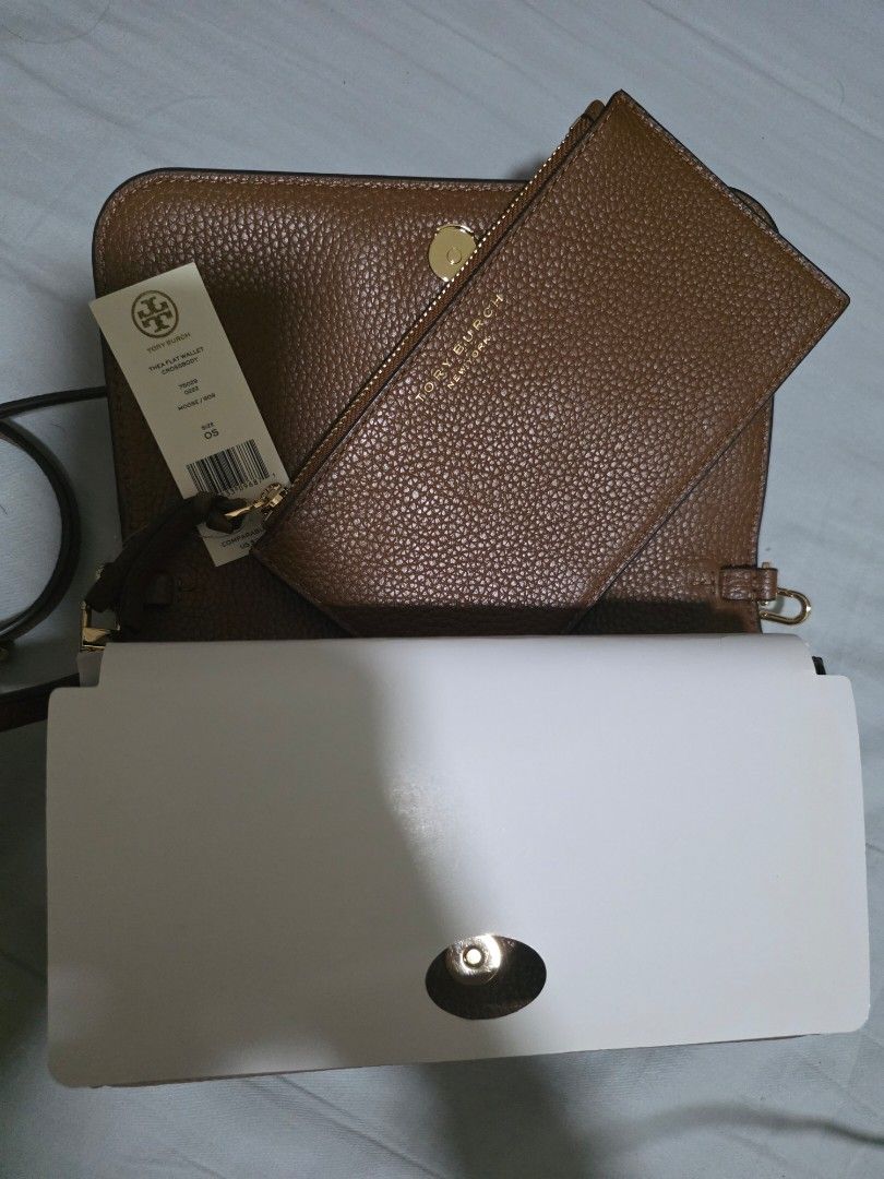 Tory Burch Thea Flap Wallet Crossbody (Category: Luxury Bags & Wallets) located in Manila. Submitted by carsel01 (Listing ID 1470485689, Image 3). Description: 100% guaranteed authentic Bought directly from US Brandnew Genuine soft pebbled leather.