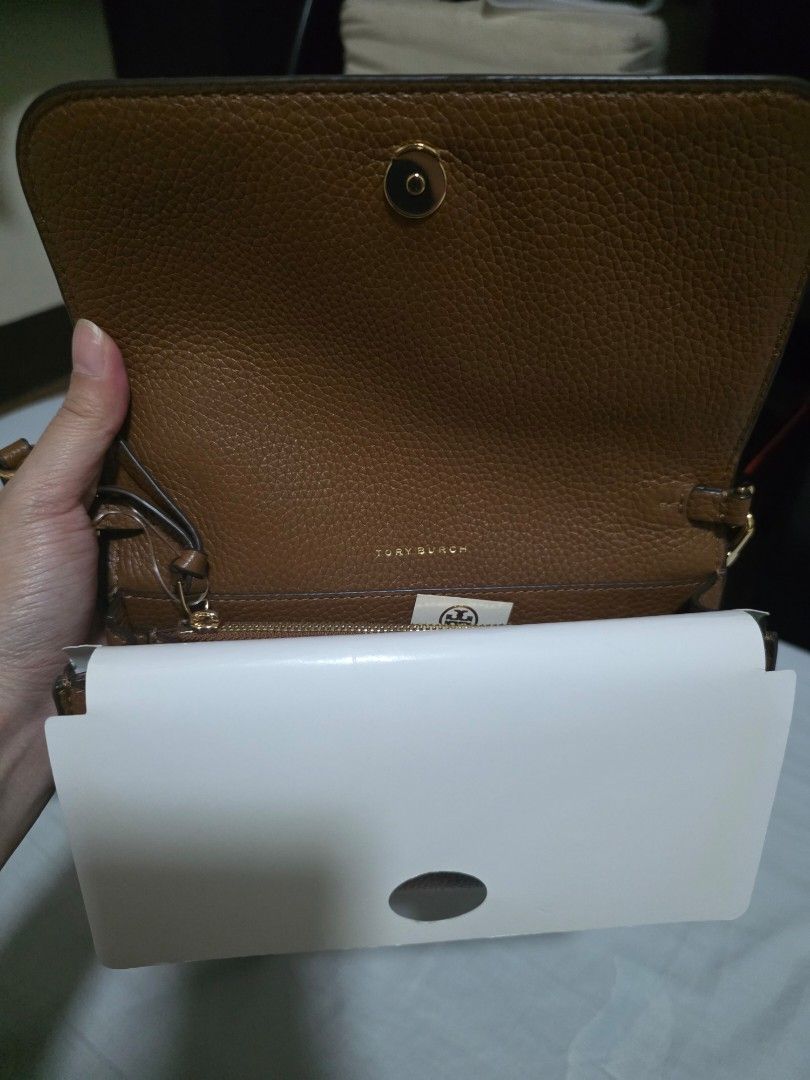 Tory Burch Thea Flap Wallet Crossbody (Category: Luxury Bags & Wallets) located in Manila. Submitted by carsel01 (Listing ID 1470485689, Image 2). Description: 100% guaranteed authentic Bought directly from US Brandnew Genuine soft pebbled leather.
