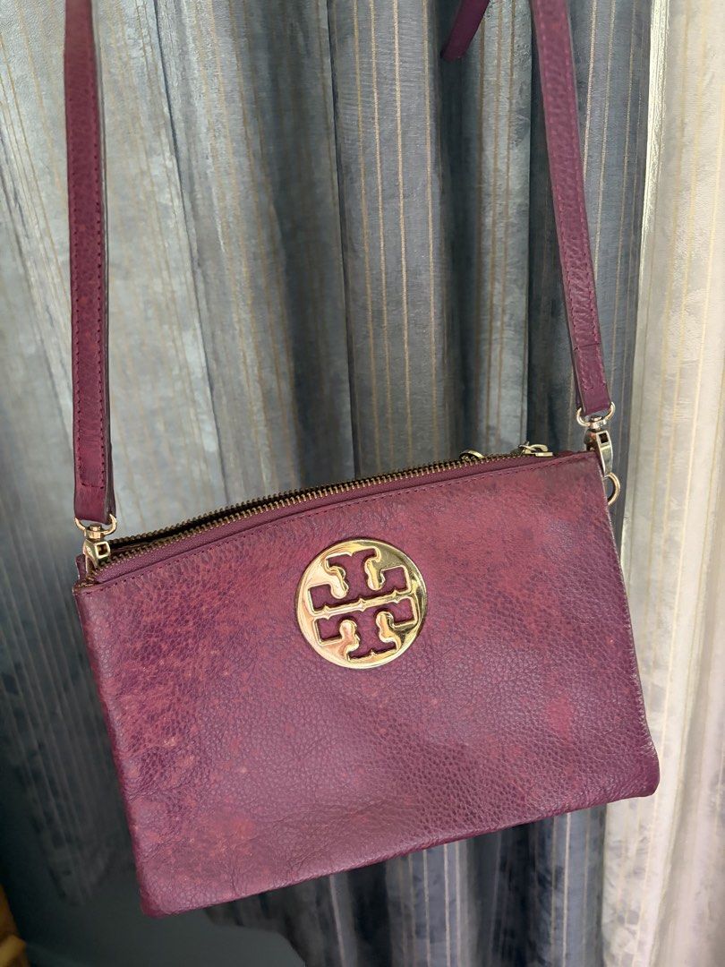Tory Burch trio bag (Category: Cross-body Bags) located in Quezon City. Submitted by jocelyn__18 (Listing ID 1470391459, Image 2). Description: Authentic! With long and short shoulder strap. NOTE: discoloration!! Might need restoration for color or recolor.