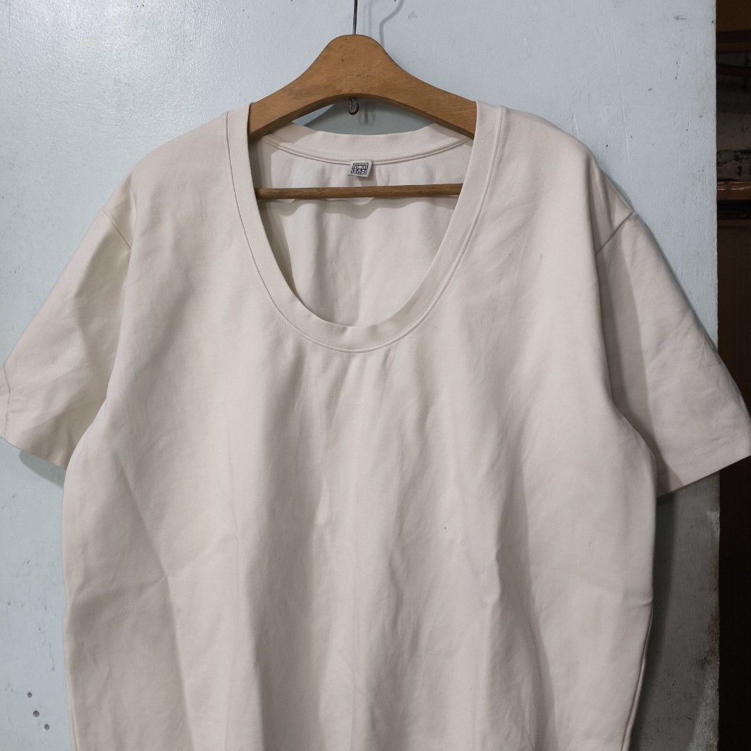 Totême Heavy Oversized T-Shirt (Category: Others Tops) located in Quezon City. Submitted by jedclo (Listing ID 1470479286, Image 2). Description: Size S Width: 24 Length: 29 In pristine condition Color due lightning MOP: GCASH, DM to purchase Disclaimer: "All brand names, logos, and images are registered trademarks of their respective owners. No affiliation or copyright infringement intended.