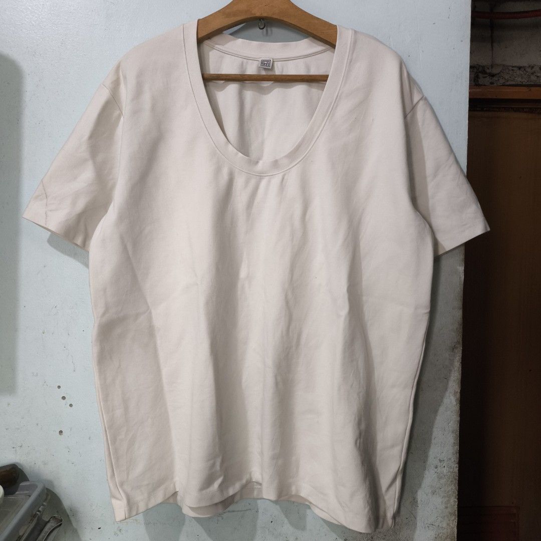Totême Heavy Oversized T-Shirt (Category: Others Tops) located in Quezon City. Submitted by jedclo (Listing ID 1470479286, Image 3). Description: Size S Width: 24 Length: 29 In pristine condition Color due lightning MOP: GCASH, DM to purchase Disclaimer: "All brand names, logos, and images are registered trademarks of their respective owners. No affiliation or copyright infringement intended.