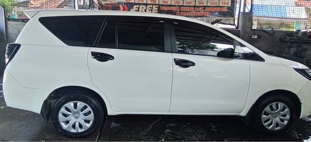 Toyota Innova (Category: Used Cars) located in Makati City. Submitted by kain44 (Listing ID 1470383323, Image 3). Description: ‼️FOR SALE:Toyota Innova J 2020 ‼️ Maayos na inalagaan at personal use.Owner moving abroad ✅ Toyota Innova J ✅ Manual Transmission ✅ Diesel Engine (Matipid sa krudo) ✅ White Pearl Color ✅ 200,000+ Odometer (Well-maintained) ✅Complete papers ready to transfer ✅Autosweep,Easytrip installed ✅ First Owner ✅ Good Running Condi