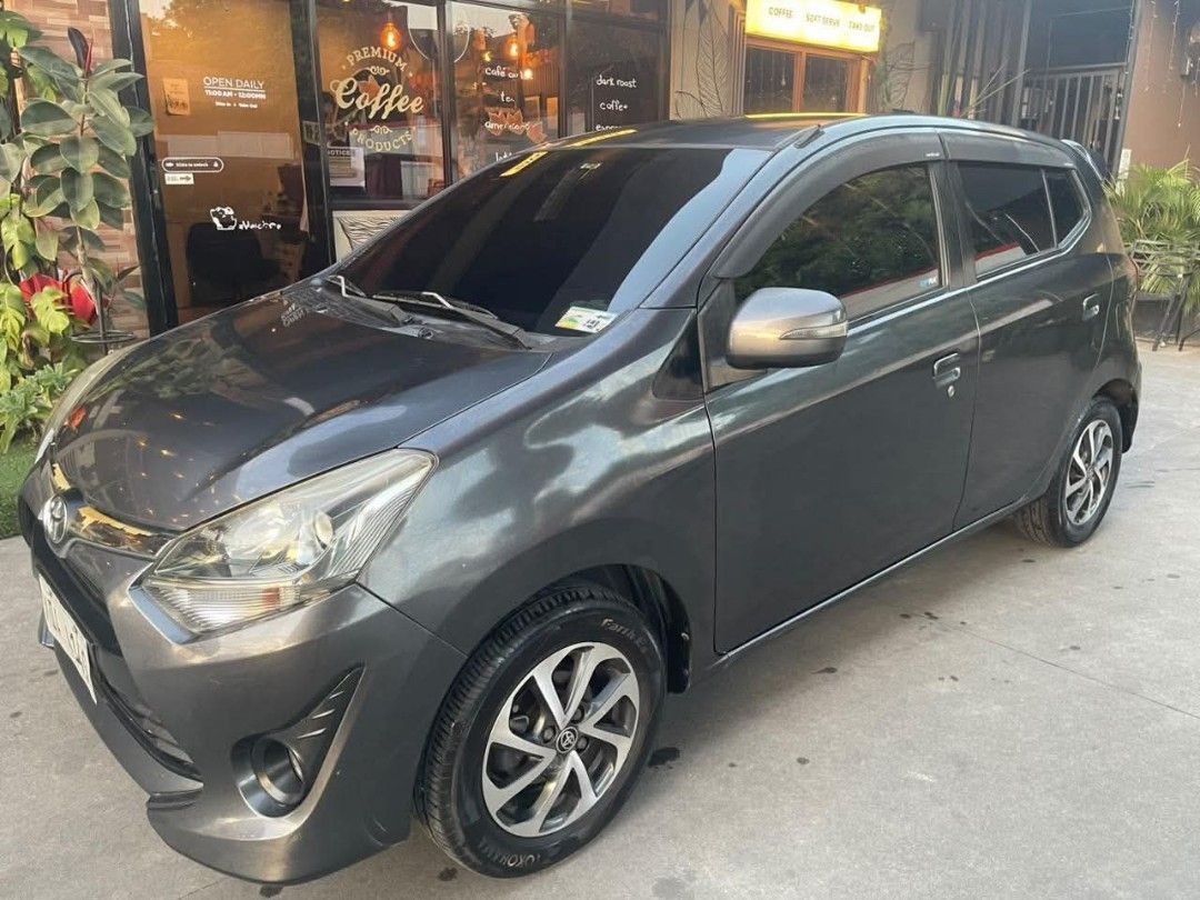 Toyota Wigo (Category: Used Cars) located in Makati City. Submitted by kennn24 (Listing ID 1470487002, Image 1). Description: FOR SALE! TOYOTA WIGO G 2019 A/T Gasoline RFS: Seldom Used Vehicle Details: -Model: Toyota Wigo G 2019 -Color: Gray -Transmission: Automatic (A/T) -Color Coding: Friday -Registration: 1 year expired MILEAGE 74k not tampered ✨ UPGRADES & INCLUSIONS: -BF Film Tint -Italian Leather Seat Covers -5D Deep Dish Matting -Stapon An