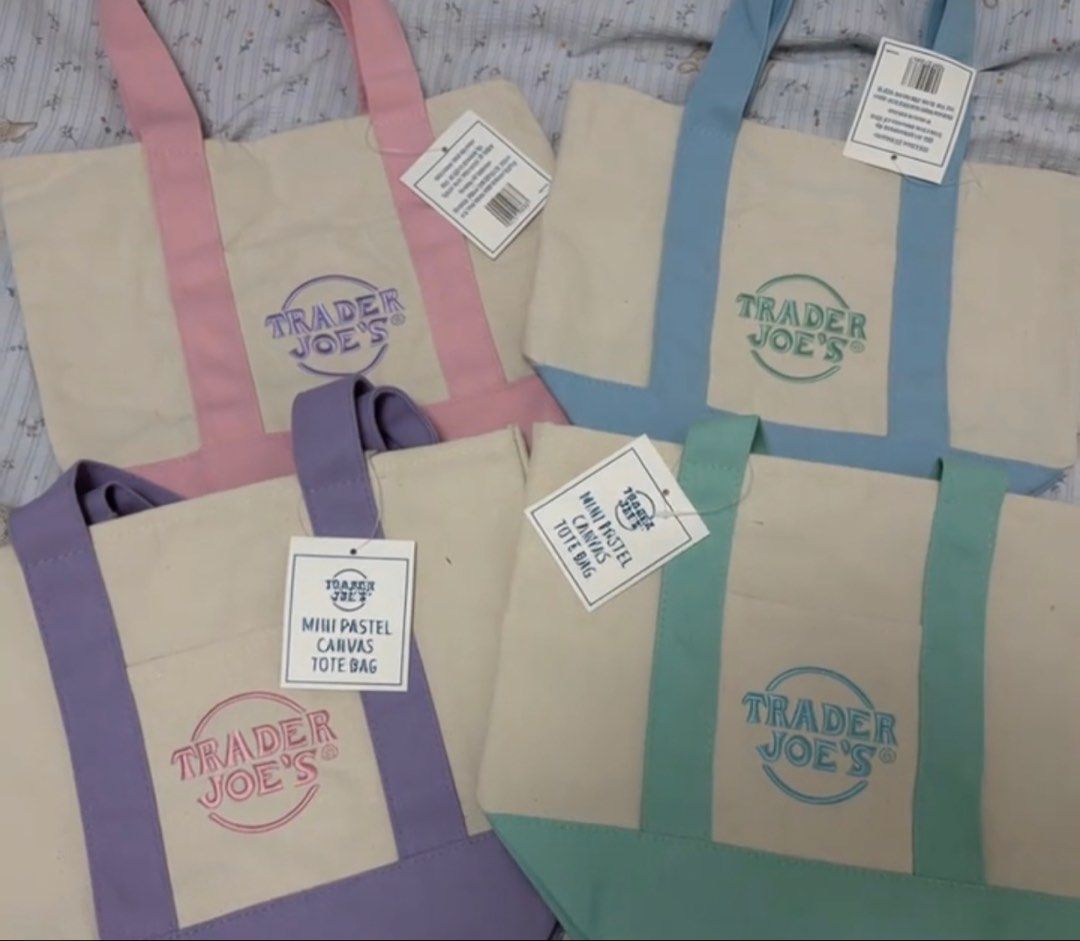 Trader Joe's Mini Pastel Canvas Tote Bag (Category: Tote Bags) located in Manila. Submitted by royalpengwen (Listing ID 1470440893, Image 2). Description: - 100% Authentic Trader Joe's Mini Pastel Canvas Tote Bag - Condition: Brand new with tags (BNWT) - Available colors: Pink, Purple, Mint Green, and Blue - Material: Durable, sturdy canvas with contrasting colored straps and bottom panel - Features: Convenient front slip pocket with embroidered 