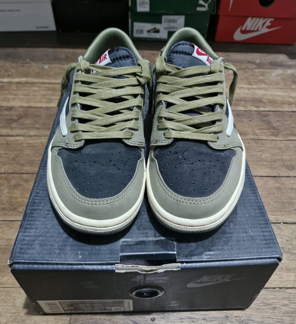 Travis Scott x Air Jordan 1 Low Olive (Category: Sneakers) located in Manila. Submitted by martinezjonill (Listing ID 1470526563, Image 2). Description: - Travis Scott collaboration sneakers in olive, black, and white - Iconic reverse swoosh design - Crafted with premium suede and leather materials - Comes with olive green laces attached - Very clean condition replacement box, extra laces mid tier.