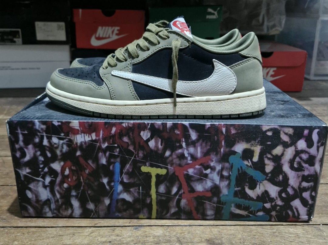 Travis Scott x Air Jordan 1 Low Olive (Category: Sneakers) located in Manila. Submitted by martinezjonill (Listing ID 1470526563, Image 1). Description: - Travis Scott collaboration sneakers in olive, black, and white - Iconic reverse swoosh design - Crafted with premium suede and leather materials - Comes with olive green laces attached - Very clean condition replacement box, extra laces mid tier.