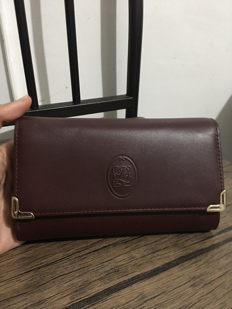 Trifold wallet/Burgundy/Genuine Leather (Category: Wallets & Card Holders) located in Morong. Submitted by vastcat.b247ee680 (Listing ID 1470475873, Image 1). Description: Item is preloved from Korea Like new condition No Issues .