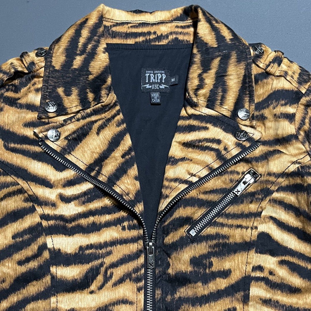 Tripp NYC - y2k - Tiger Moto Jacket (Category: Coats, Jackets and Outerwear) located in Bacolod City. Submitted by rndm.wears (Listing ID 1470524601, Image 2). Description: Tripp NYC moto biker jacket featuring tiger print 3 zippers in front with belt loops on hem snap buttons on collars Tagged as medium Length: 23.5 Width: 18.5 Sleeve: 23.5.