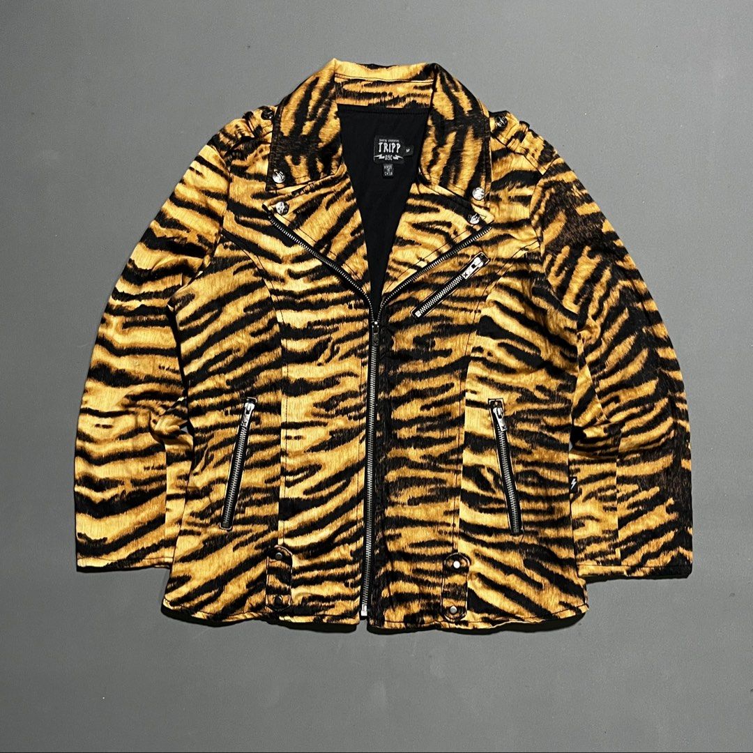 Tripp NYC - y2k - Tiger Moto Jacket (Category: Coats, Jackets and Outerwear) located in Bacolod City. Submitted by rndm.wears (Listing ID 1470524601, Image 1). Description: Tripp NYC moto biker jacket featuring tiger print 3 zippers in front with belt loops on hem snap buttons on collars Tagged as medium Length: 23.5 Width: 18.5 Sleeve: 23.5.