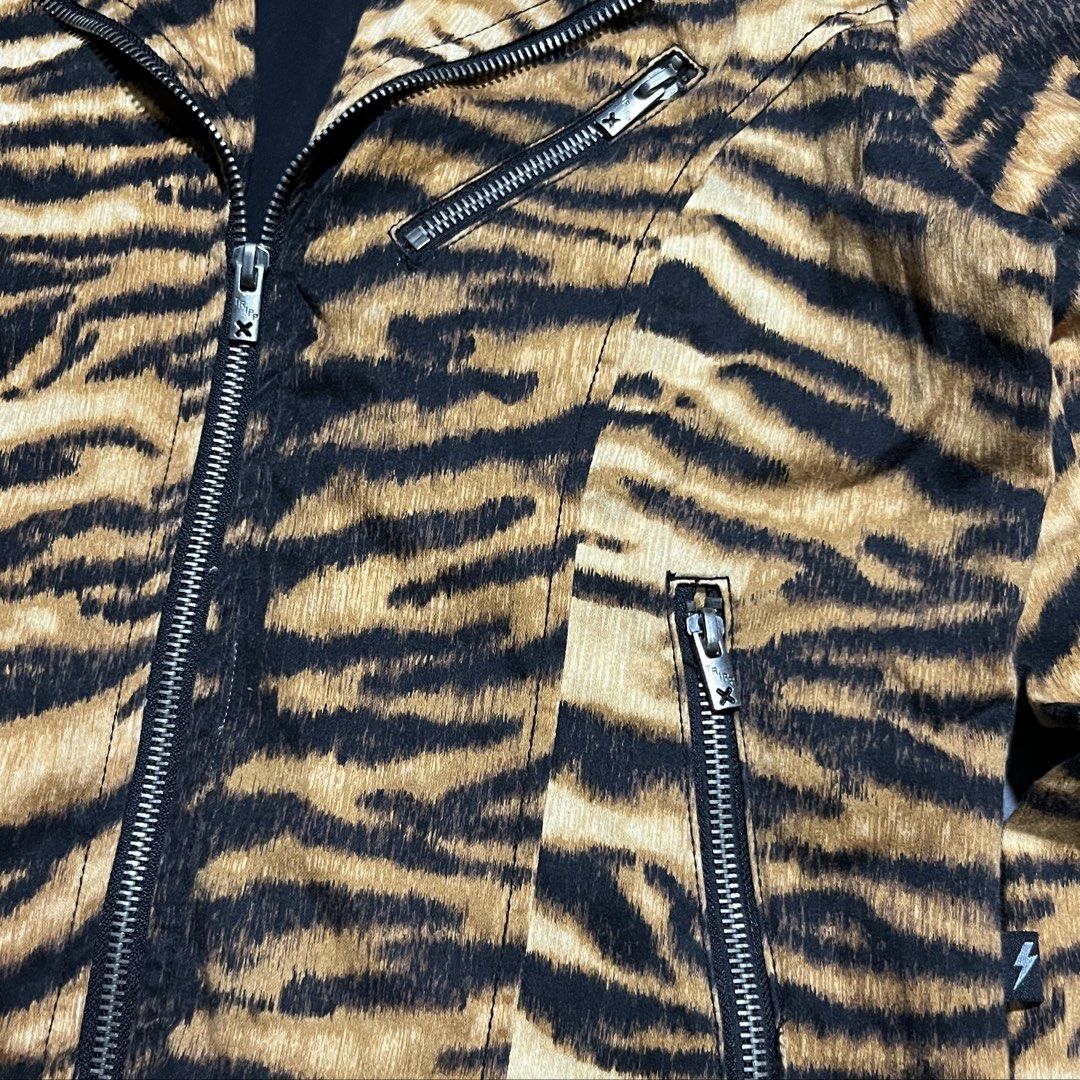Tripp NYC - y2k - Tiger Moto Jacket (Category: Coats, Jackets and Outerwear) located in Bacolod City. Submitted by rndm.wears (Listing ID 1470524601, Image 3). Description: Tripp NYC moto biker jacket featuring tiger print 3 zippers in front with belt loops on hem snap buttons on collars Tagged as medium Length: 23.5 Width: 18.5 Sleeve: 23.5.