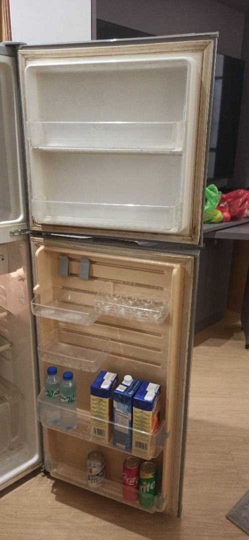 Two Door Small Refrigerator (Category: Refrigerators and Freezers) located in Manila. Submitted by peterp77 (Listing ID 1470402949, Image 3). Description: - Type: Two-door fridge with top freezer compartment - 224 L - Storage: Door shelves for drinks/cartons, egg tray, and bottom crisper drawer - Shelves: Removable glass shelves for flexible organization - Condition: Clean interior, all bins intact, and 100% working - Ideal For: Small apartments,