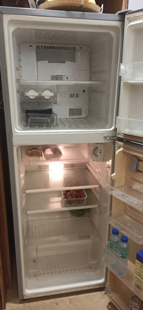 Two Door Small Refrigerator (Category: Refrigerators and Freezers) located in Manila. Submitted by peterp77 (Listing ID 1470402949, Image 1). Description: - Type: Two-door fridge with top freezer compartment - 224 L - Storage: Door shelves for drinks/cartons, egg tray, and bottom crisper drawer - Shelves: Removable glass shelves for flexible organization - Condition: Clean interior, all bins intact, and 100% working - Ideal For: Small apartments,