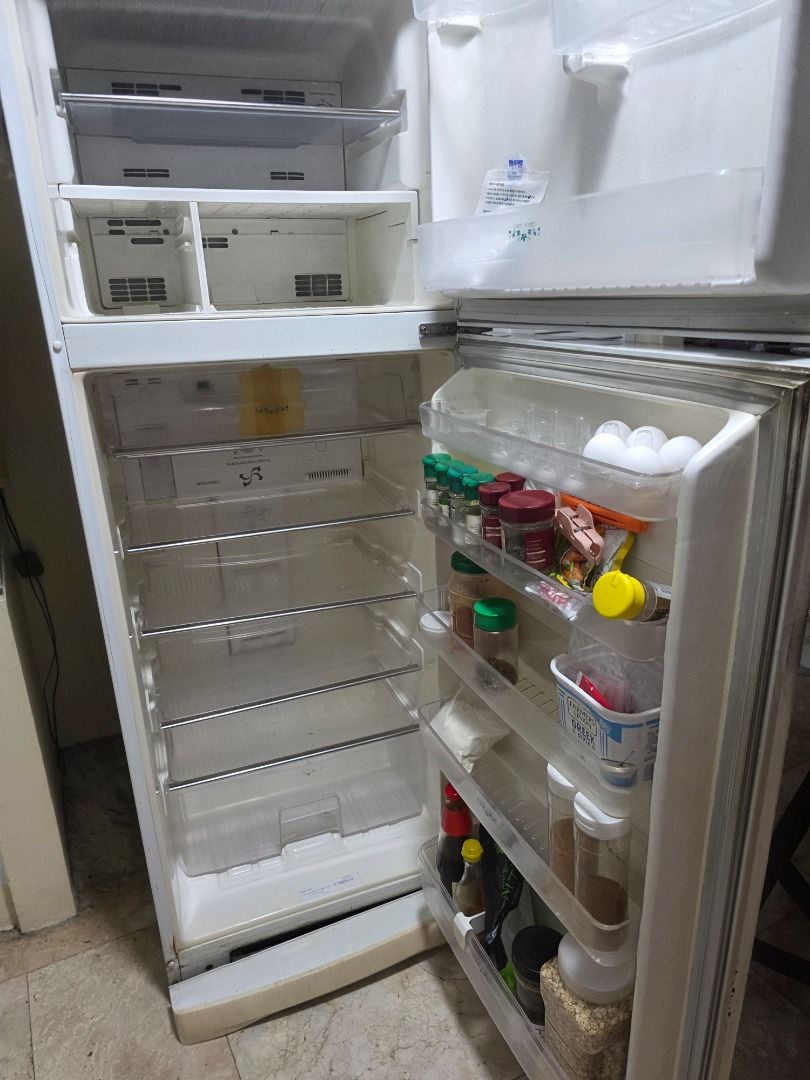 Two Door Top Freezer Refrigerator White (Category: Refrigerators and Freezers) located in Caloocan City. Submitted by clevergem.7897e2 (Listing ID 1470495425, Image 2). Description: Working white double-door fridge with top freezer and glass shelves. Clean, spacious, and perfect for apartments or extra storage. Pick up only!.