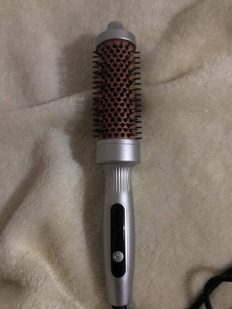Ubeator Multifunctional Thermal Brush (Category: Hair) located in Las Pinas. Submitted by armariodemaria (Listing ID 1470545947, Image 1). Description: Electric hair styling comb in sleek silver and orange. Features a dual-function design for drying and curling, digital temp display, and an ergonomic handle with a swivel cord. Perfect for quick, everyday styling. Like new, used only a few times. RFS: Decluttering.