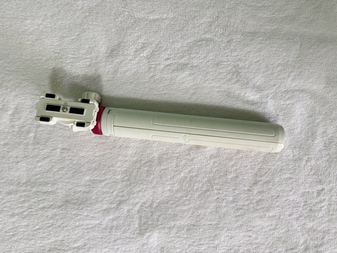Ulanzi MT-44 Extendable Selfie Stick Tripod (Category: Tripods & Monopods) located in Manila. Submitted by mmilaomls (Listing ID 1470405956, Image 3). Description: - Model: Ulanzi MT-44 Mini Tripod & Selfie Stick - Color: Sleek white with stylish red accents - Dual Function: Easily converts from a handheld selfie stick to a sturdy tabletop tripod - Built-in Mount: Features an integrated phone clamp with a standard 1/4" screw underneath for versat