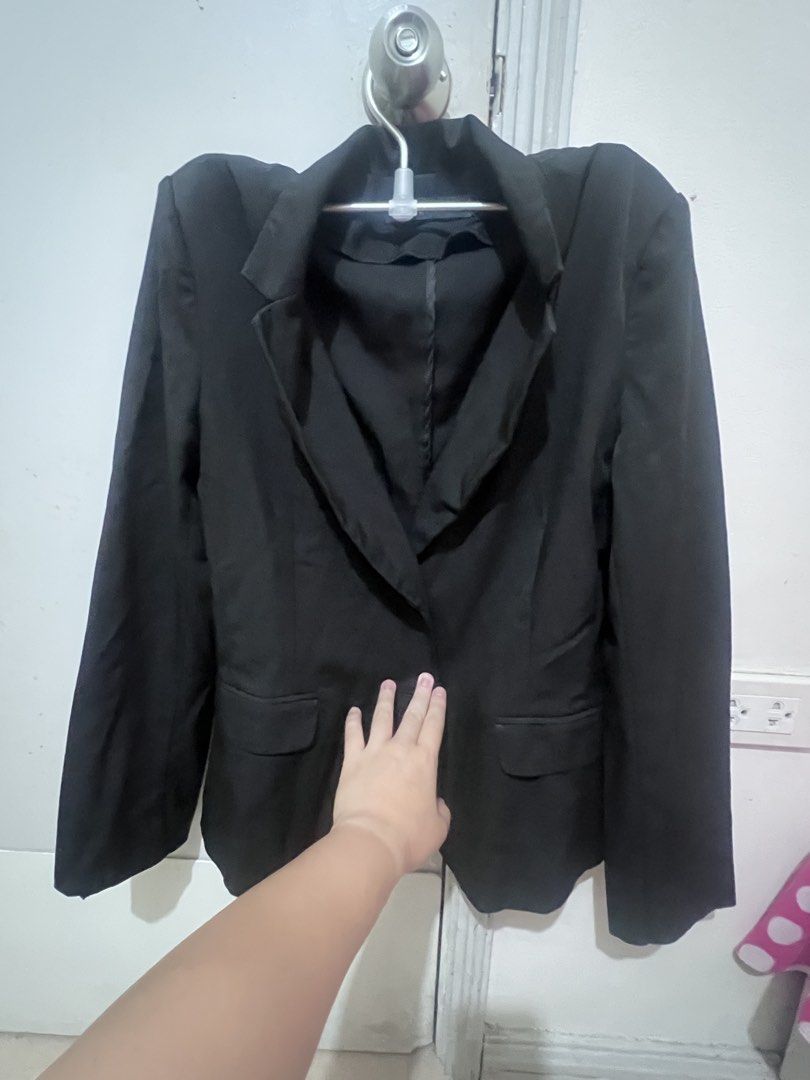UNA Black Blazer Size L (Category: Coats, Jackets and Outerwear) located in Manila. Submitted by reyctennis (Listing ID 1470399226, Image 1). Description: - Brand: UNA - Size: Large (True to size) - Color: Classic Black - Closure: Single-button front - Pockets: Two functional flap pockets - Style: Structured lapel collar, long sleeves, clean lines - Versatile: Ideal for workwear or elevating casual outfits.