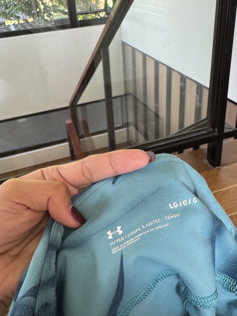 Under Armour Fitted Leggings Teal Leaf Pattern Size L (Category: Activewear) located in Rizal. Submitted by mharieshine (Listing ID 1470413534, Image 2). Description: - Brand: Under Armour - Size: LG/G/G - Color/Pattern: Teal with dark blue leaf print - Fit: Fitted style, comfortable for workouts or casual wear - Condition: Clean, tags printed inside waistband - Origin: Made in Jordan.
