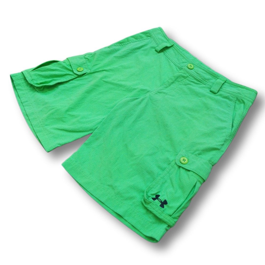 Under Armour Neon Cargo Shorts (Size 29) (Category: Shorts) located in Cavite. Submitted by spinfits (Listing ID 1470425734, Image 2). Description: - Brand: Under Armour - Material: Lightweight ripstop fabric with mesh-lined waist - Closure: Button fly with belt loops - Pockets: 2 front pockets and 2 buttoned side cargo pockets - Details: Black Under Armour logo on the right pocket flap Size (INCHES) Waist: 29 length: 18.5 Thigh: 12 Leg opening: 