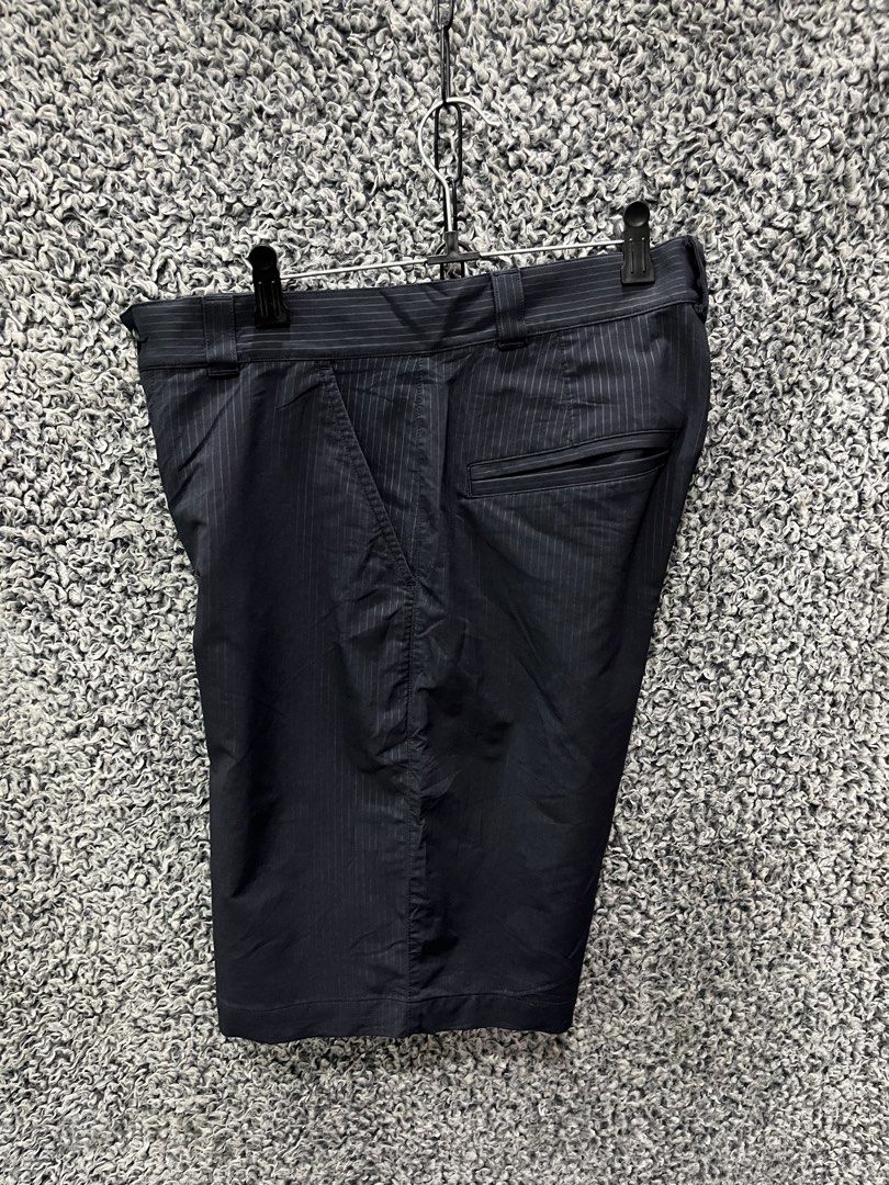 Under Armour Performance Pinstripe Golf Shorts. | Size 32 (Category: Shorts) located in General Trias. Submitted by zrchustle.604 (Listing ID 1470497446, Image 3). Description: Under Armour Performance Pinstripe Golf Shorts. They feature a lightweight, moisture-wicking stretch construction designed specifically for mobility and breathability on the golf course. Key Details & Identification Features: • Brand Logo: The signature Under Armour logo i