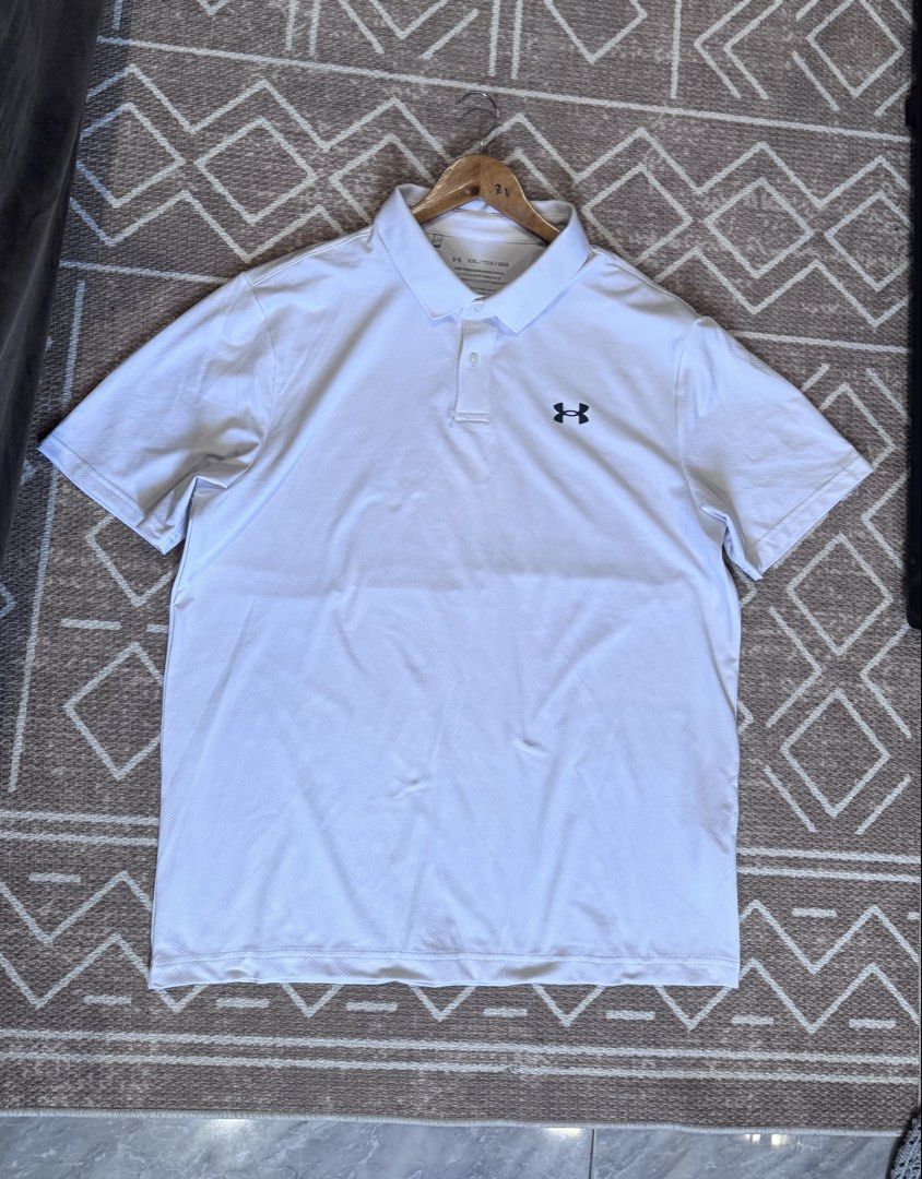 Under Armour The Performance Polo White XXL (Category: Tshirts & Polo Shirts ) located in Bulacan. Submitted by zyannechlo86360 (Listing ID 1470357878, Image 1). Description: - Brand: Under Armour - Model: The Performance Polo - Color: White - Size: XXL (Loose fit) - Fabric: Lightweight and breathable HeatGear - Details: Classic collared neckline with two-button placket, black UA logo on left chest and back collar - Origin: Made in Vietnam.
