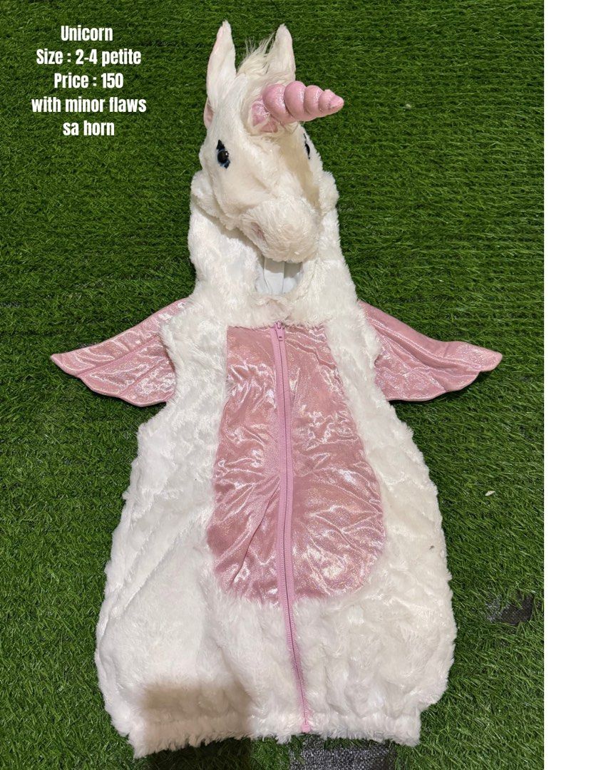 Unicorn Costume Size 2-4 Petite (Category: Babies & Kids Fashion) located in San Fernando. Submitted by InvisibleMe (Listing ID 1470451746, Image 1). Description: - Item: White Unicorn Costume - Size: 2-4 Petite - Features: Fluffy white material, pink belly panel, matching pink wings, and hood with a pink horn - Closure: Front zipper - Condition: Good, with minor flaws on the horn - Perfect for costume parties, trick-or-treating, or fun dress-up 
