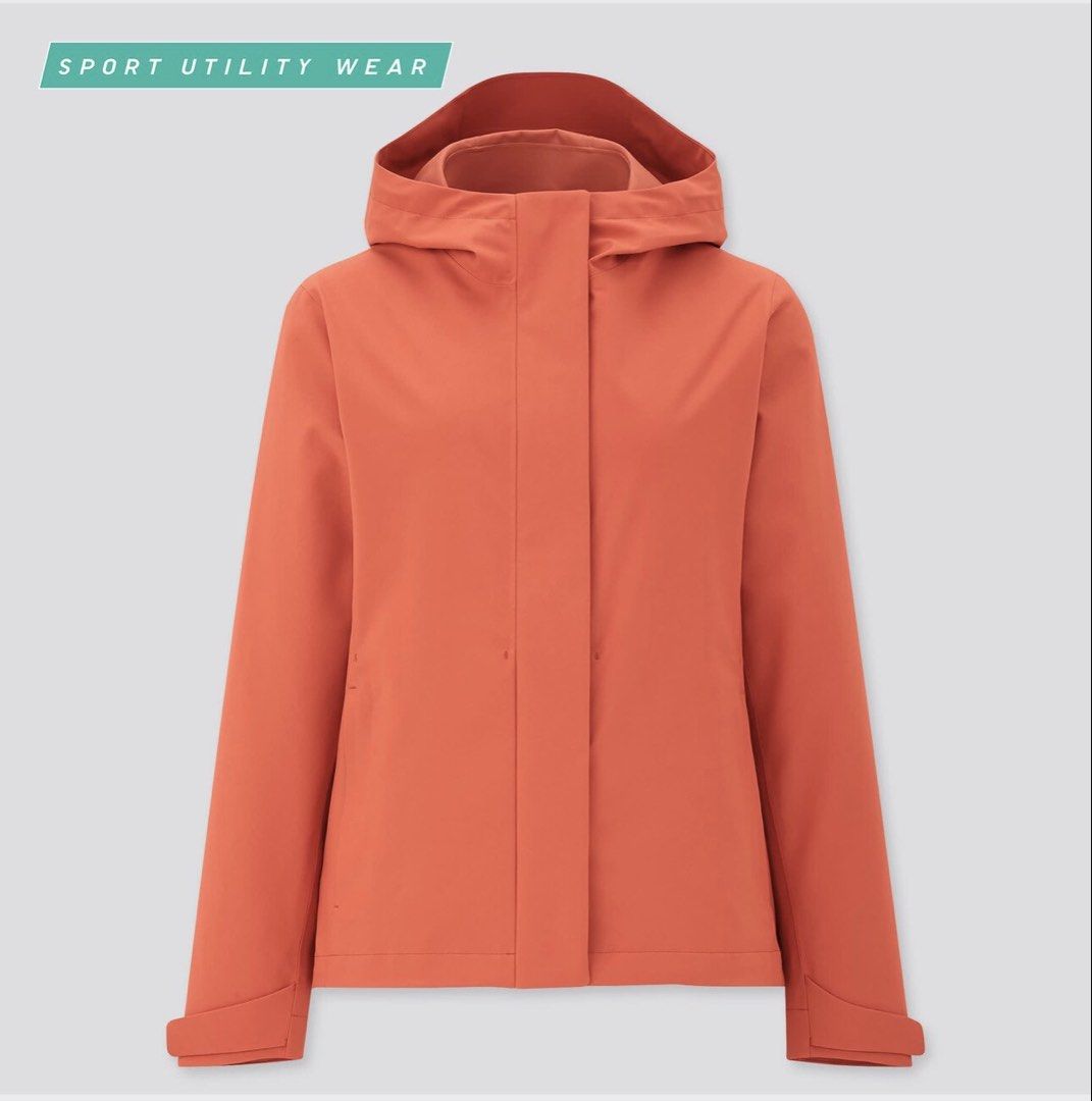 UNIQLO Blocktech Parka Size M (Category: Coats, Jackets and Outerwear) located in Manila. Submitted by mmilaomls (Listing ID 1470404335, Image 1). Description: - Brand: UNIQLO - Color: Red Orange - Size: Medium (M) - Features: Water resistant, windproof, durable water repellency, breathable, and stretch fabric - Design: Full front zip with snap button flap overlay, and adjustable hood with drawstrings and toggles - Condition: Clean inner lining a