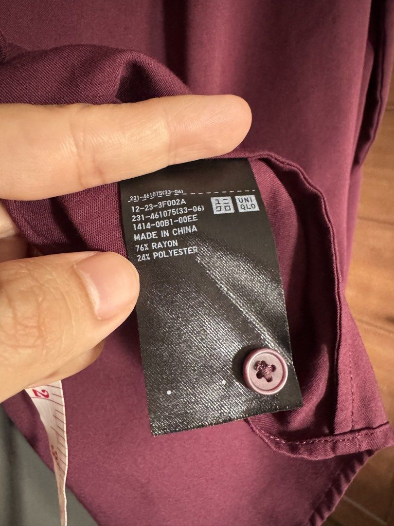 UNIQLO Long Sleeve Button Down Blouse Burgundy Size M (Category: Longsleeves) located in Dasmarinas. Submitted by akelvin23 (Listing ID 1470429921, Image 2). Description: - Brand: UNIQLO - Color: Deep burgundy - Size: M - Material: 76% rayon, 24% polyester blend - Design: Button-down front with matching buttons, classic collar, button cuffs, and elegant back pleat detail Width - 18.5 in Length - 26 in Shoulder - 15 in Sleeve - 21.5 in.