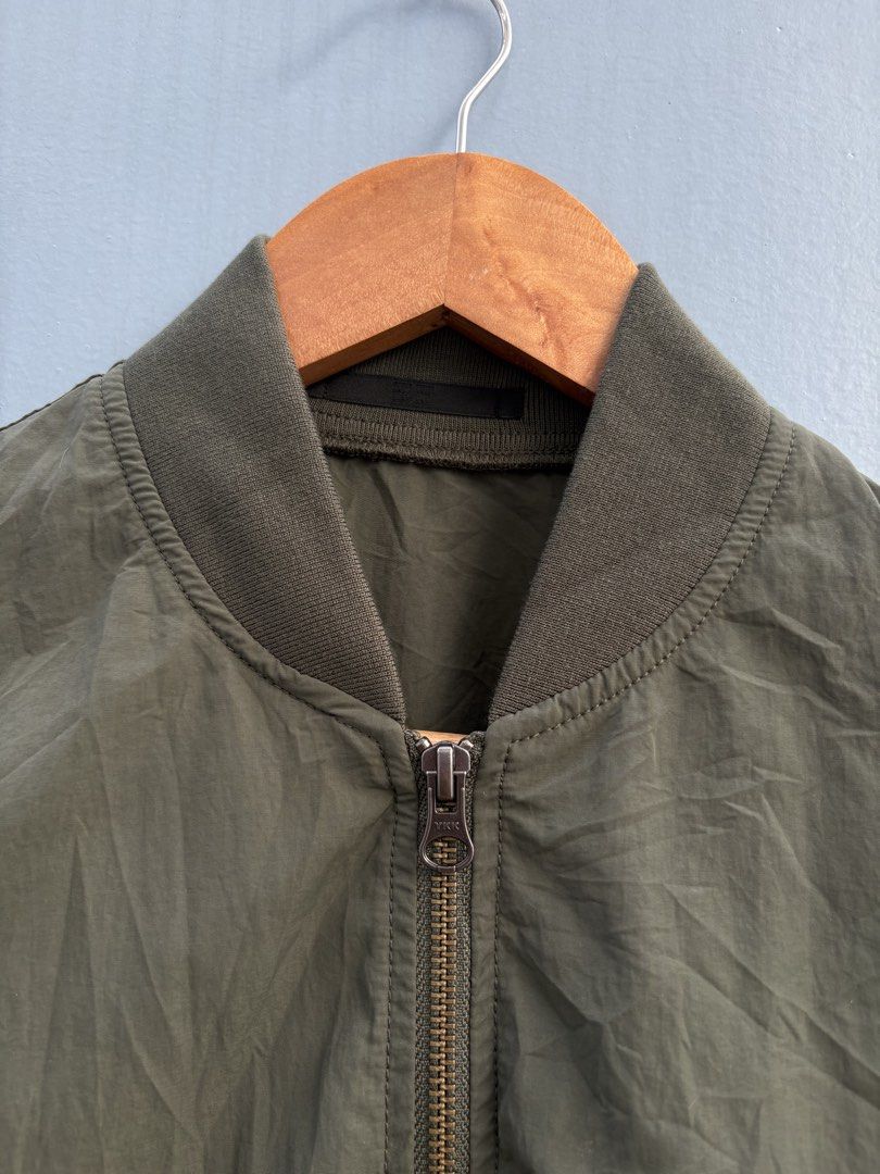 Uniqlo olive green MA-1 bomber jacket (Category: Coats, Jackets and Outerwear) located in General Santos City (Dadiangas). Submitted by a.rt.eyes (Listing ID 1470468142, Image 3). Description: Uniqlo olive green MA-1 bomber jacket Size small on tag Dimension width 19 length 22 Excellent condition with no issues Color rate 10/10 Original Located in General Santos City, Mindanao. Shipping fee applies for buyers outside my location. Payment first on