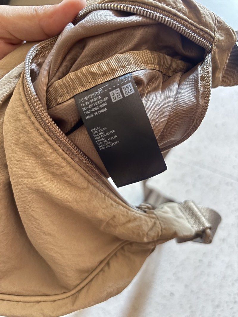 Uniqlo Round Mini Shoulder Bag - Brown (Category: Shoulder Bags) located in Taguig. Submitted by solana36 (Listing ID 1470363455, Image 2). Description: No issue RFS: Decluttering Location: East Rembo, Taguig SF c/o buyer.