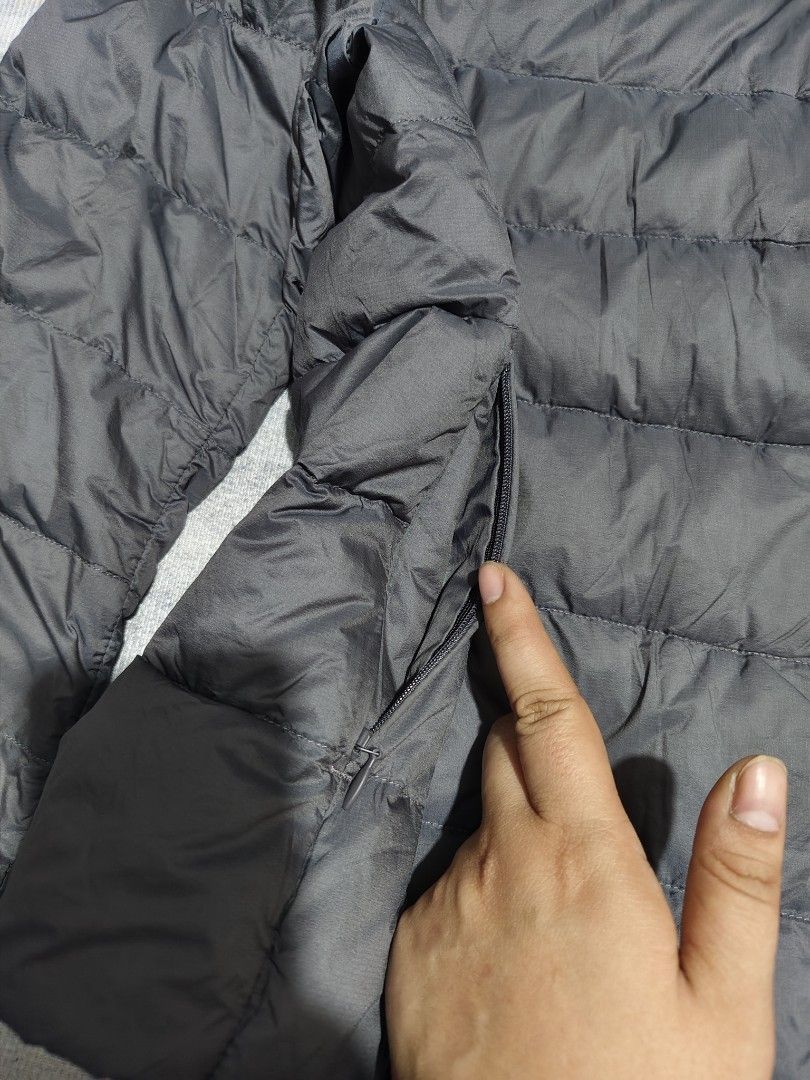 UNIQLO ULTRA LIGHT DOWN JACKET (Category: Coats, Jackets and Outerwear) located in Dagupan City. Submitted by gandita.28 (Listing ID 1470453566, Image 2). Description: UNIQLO ULTRA LIGHT DOWN JACKET LIGHTWEIGHT DURABLE WATER REPELLENCY LENGTH - 22 WIDTH - 18.
