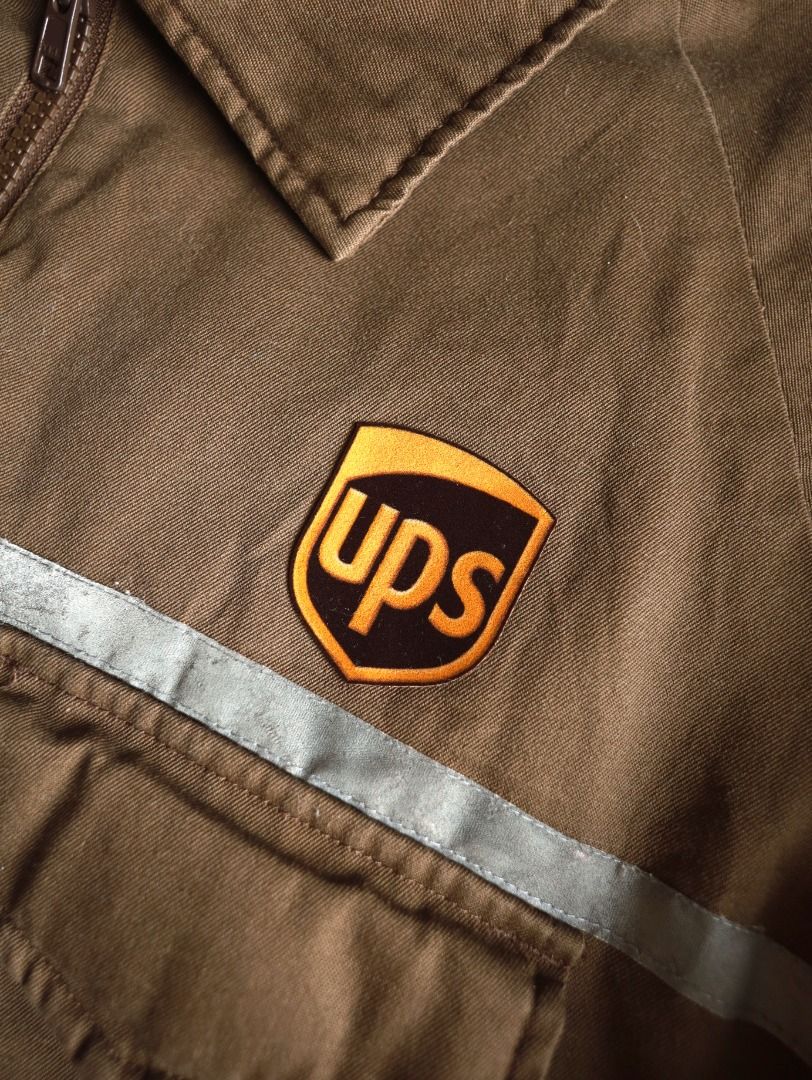UPS Authorized Half-Zip Workwear Jacket (Category: Coats, Jackets and Outerwear) located in Pasig City. Submitted by mlclmchrs (Listing ID 1470440943, Image 2). Description: Sizing: XL - 2xl (Boxy fit) Width - 27 inches Length - 26 inches Sleeve length - 18 inches Issues: small damages on reflectorized strip.
