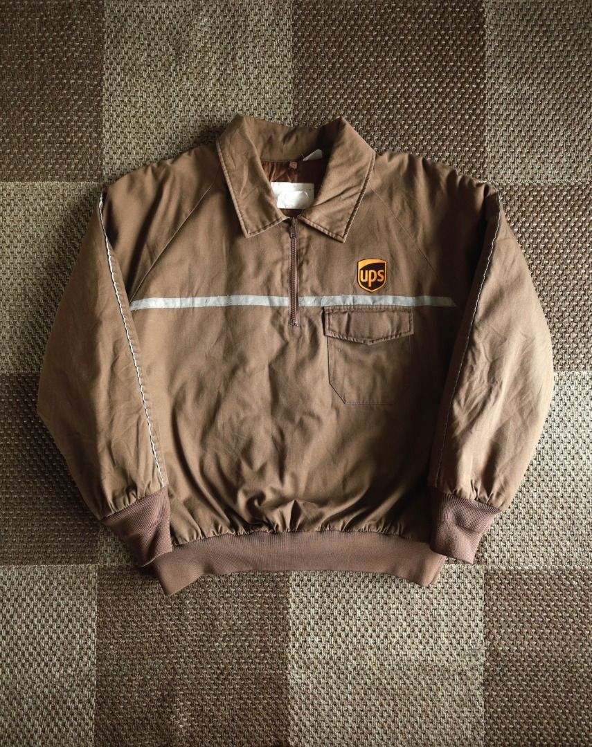 UPS Authorized Half-Zip Workwear Jacket (Category: Coats, Jackets and Outerwear) located in Pasig City. Submitted by mlclmchrs (Listing ID 1470440943, Image 1). Description: Sizing: XL - 2xl (Boxy fit) Width - 27 inches Length - 26 inches Sleeve length - 18 inches Issues: small damages on reflectorized strip.