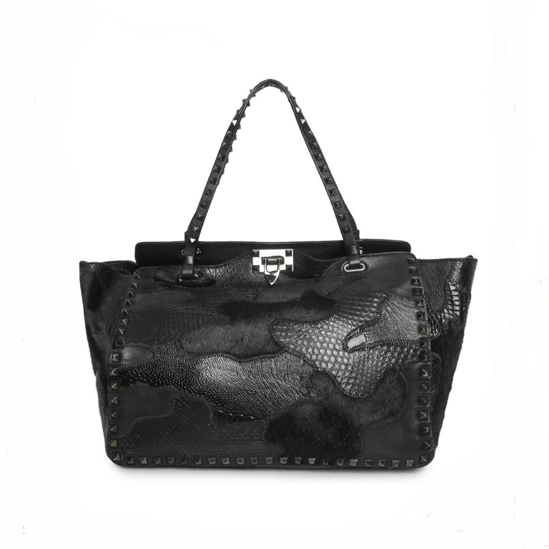 Valentino Exotic Leather Rockstud Shopper Tote (Category: Luxury Bags & Wallets) located in Pasay City. Submitted by erinsclosetph (Listing ID 1470510304, Image 1). Description: Exotic Leather Rockstud Shopper Tote w/ detachable strap. Relaxed shape, wear on corners, creasing on sides, hairline scratching on hardware, clean interior. Brand: Valentino Colour: Black Pattern: Camoflage Fabric: Leather Condition: Excellent Dust Bag: With Dust Bag Cat