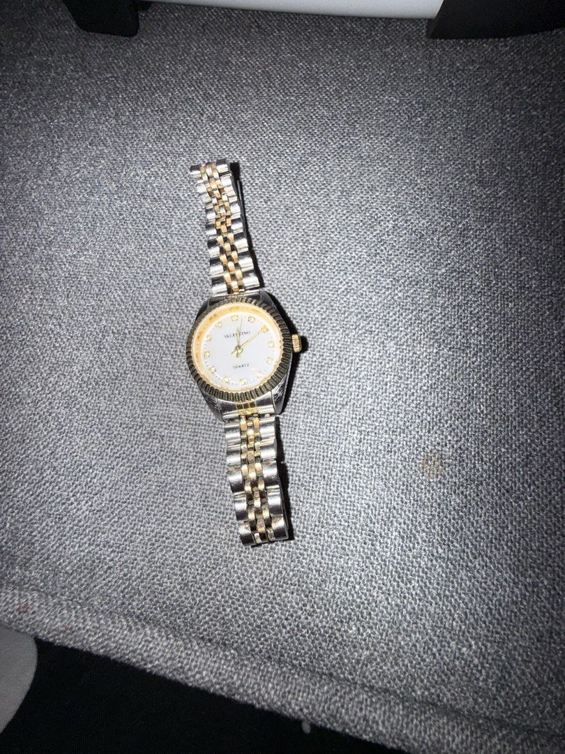 Valentino Two-Tone Quartz Watch Model 3230 (Category: Women's Watches) located in Manila. Submitted by rare.desteen (Listing ID 1470375888, Image 1). Description: - Brand/Model: Valentino Quartz Wristwatch (Model 3230) - Design: Two-tone stainless steel bracelet with luxurious gold-plated bezel, crown accents, and fluted bezel details - Dial: Round dial featuring elegant rhinestone hour markers - Movement: Reliable Japanese quartz movement - Buil