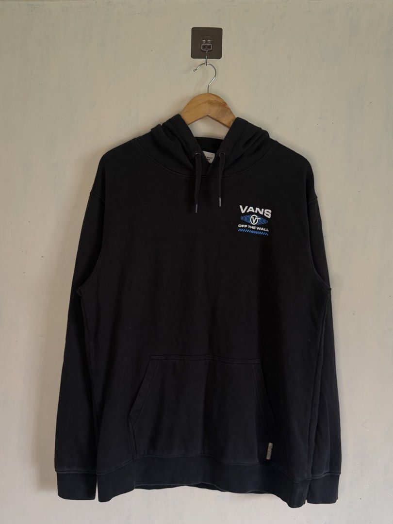 Vans Off The Wall Black Pullover Hoodie Size L (Category: Hoodies) located in Manila. Submitted by snipe.shit (Listing ID 1470422482, Image 1). Description: - Brand: Vans - Color: Black - Size: Large - Design: Classic 'Off The Wall' graphic on chest and back with blue soundwave and checkerboard details - Features: Drawstring hood and front kangaroo pocket - Material: Cotton and polyester blend - Origin: Made in Guatemala - Condition: Excellent pr