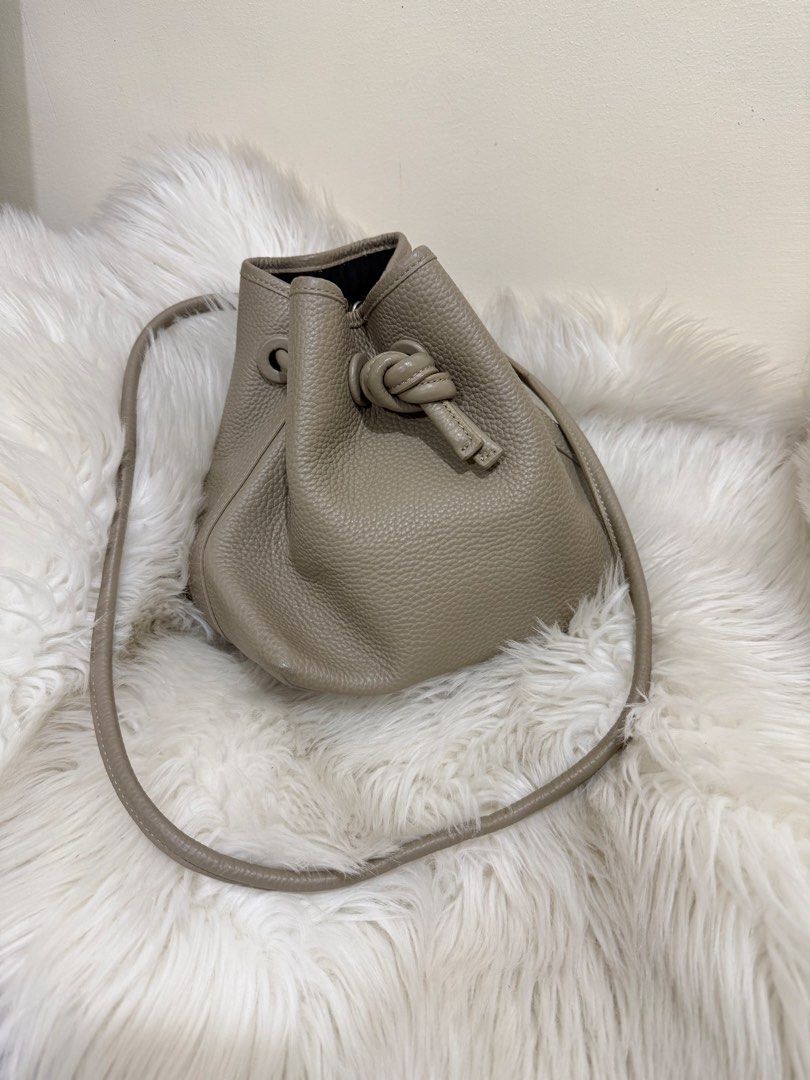 VASIC Bond Mini Bucket Bag Taupe Leather (Category: Cross-body Bags) located in Solano. Submitted by hayami. (Listing ID 1470350829, Image 1). Description: 𝗩𝗔𝗦𝗜𝗖 Bond Mini Knot Leather Bag Can be worn as a crossbody Retails at ₱28,500 Preloved price online starts at ₱14,000.