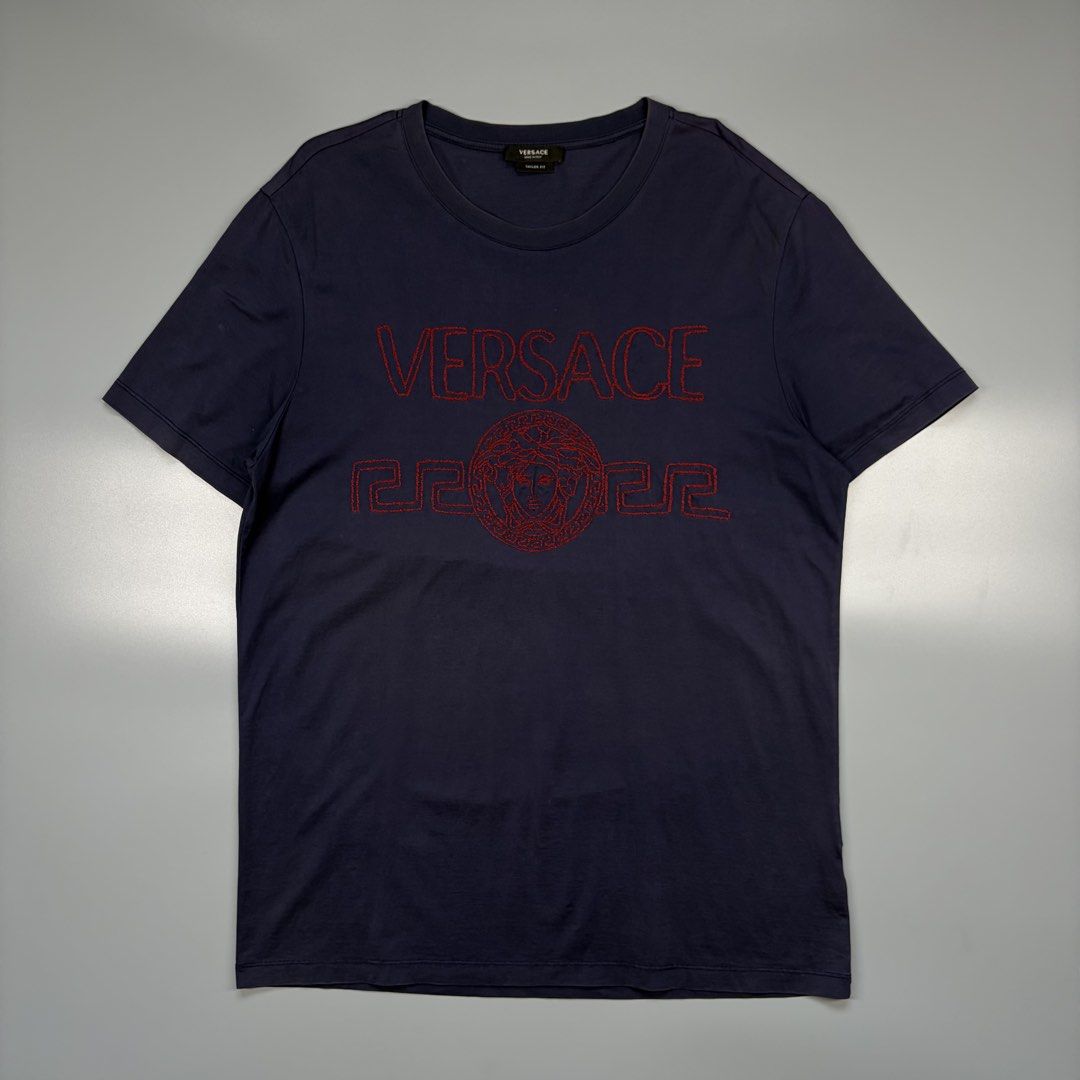 Versace Embroidered (Authentic) (Category: Luxury Apparel) located in Cavite. Submitted by onebeancent (Listing ID 1470557057, Image 2). Description: Size: Large (Men) | XL to XXL (Women's) Dimension: 21" Width | 30" Length Color: Navy Blue Color Rate: 9/10 Issue: None Condition: Excellent Price: 880php Additional Shipping Fee (J&T Small Pouch) 75php Luzon 100php visayas 120php mindanao.