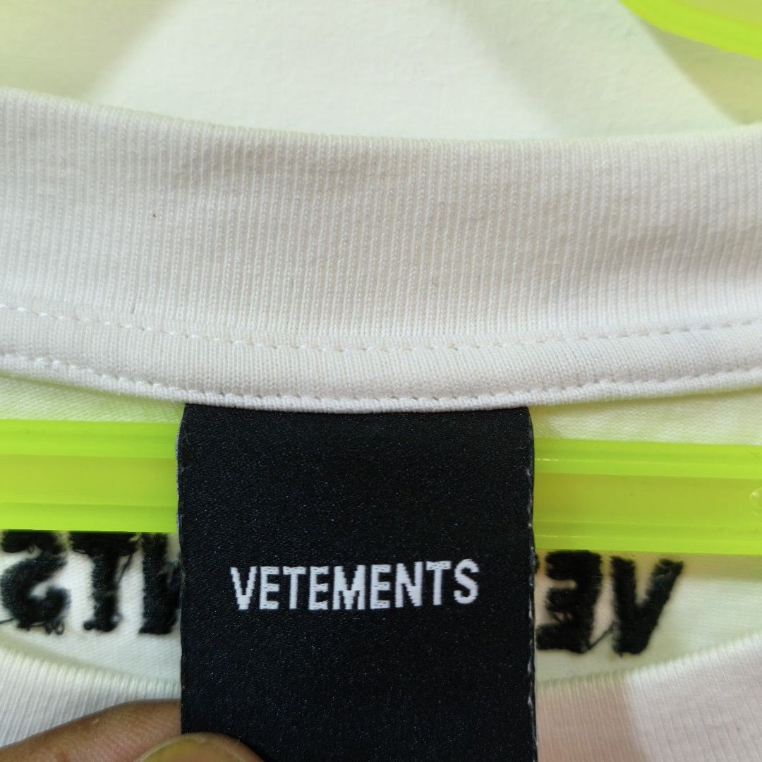 Vetemets White T-Shirt Size XL (Category: Tshirts & Polo Shirts ) located in Quezon City. Submitted by inrelationthrift (Listing ID 1470431790, Image 2). Description: - Brand: Vetements - Style: Oversized relaxed fit t-shirt - Color: White with bold black logo on chest and back neckline - Size: XL - Material: 100% premium cotton - Condition: Excellent to good as new - Color rate: 10/10 - Issue: None - Measurements in the product photos - Slightly
