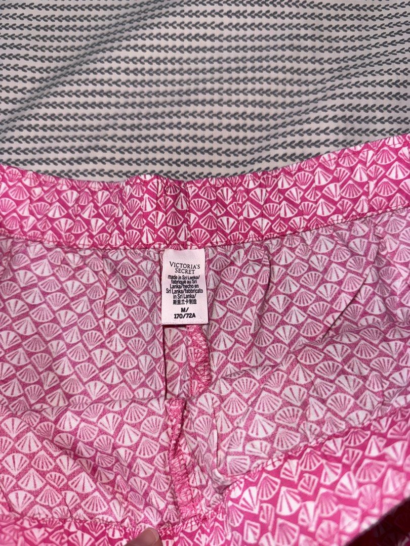 Victoria's Secret Pink Shell Pattern Sleep Shorts (Category: Undergarments & Loungewear) located in Santa Ana. Submitted by fatikilla (Listing ID 1470360292, Image 3). Description: - Brand: Victoria's Secret - Design: Bright pink and white shell print with front woven brand patch - Fit: Relaxed fit with a comfortable elastic waistband - Size: Medium (170/72A) - Origin: Made in Sri Lanka - Condition: Clean, fresh, and ready to wear - Ideal for: Sl